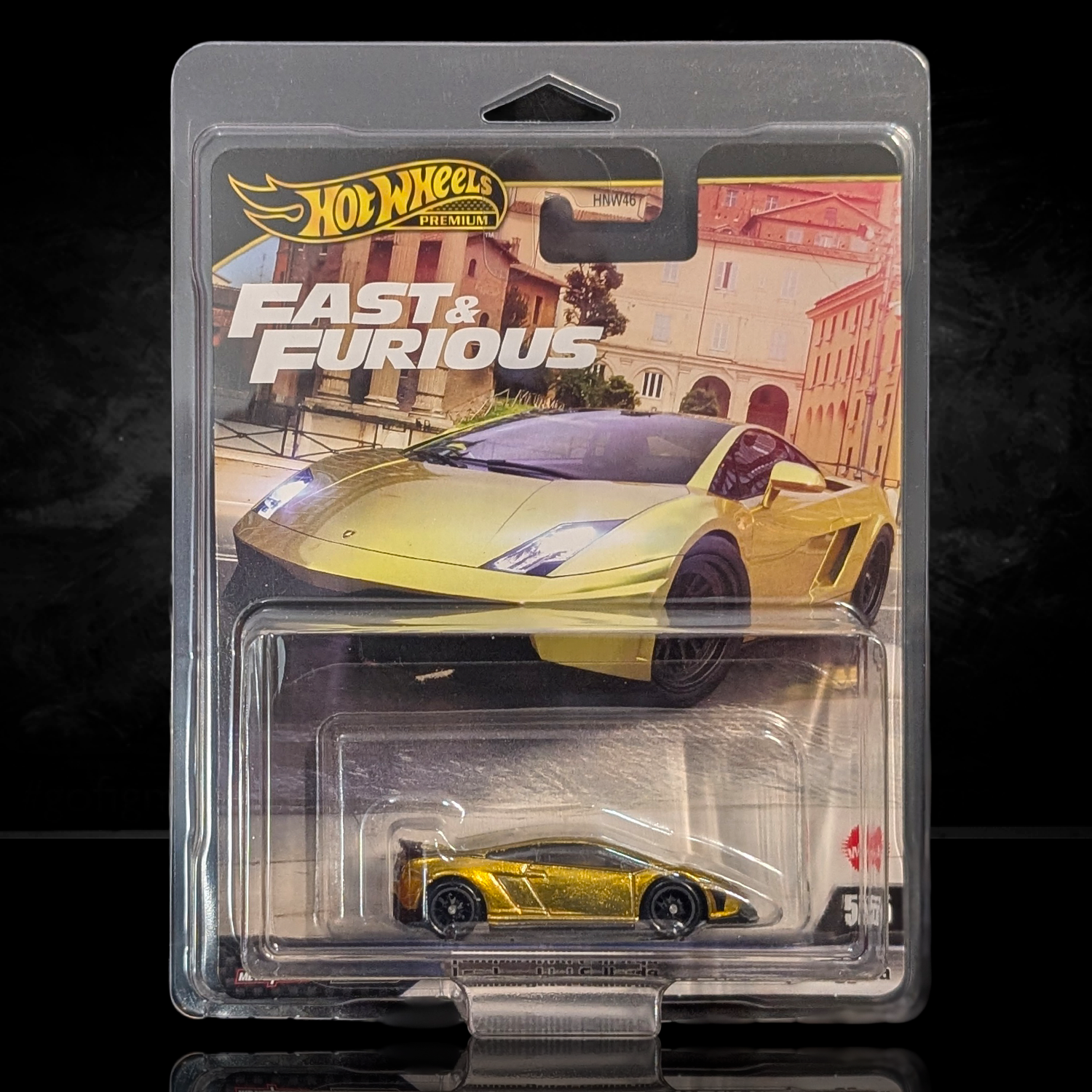 Hot Wheels Premium Fast & Furious 1:64 scale gold die-cast car with detailed Real Riders wheels in collector packaging