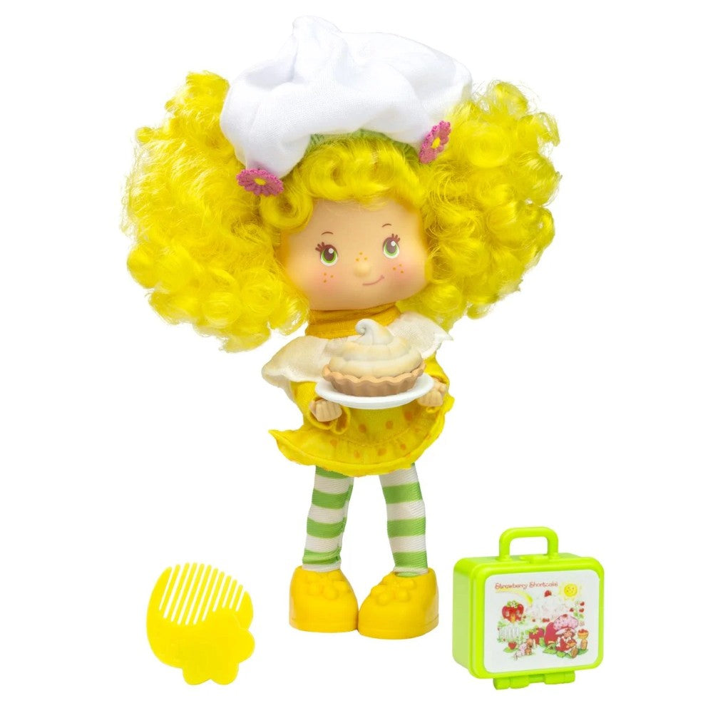 5 1/2-inch Loyal Subjects Strawberry Shortcake Lemon Meringue doll with yellow curls holding lemon meringue pie and accessories