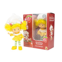 5 1/2-inch Strawberry Shortcake Lemon Meringue fashion doll with yellow dress and white hat by Loyal Subjects in red window box