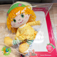 Loyal Subjects Strawberry Shortcake Lemon Meringue 14-inch scented rag doll in retro yellow dress and green hat