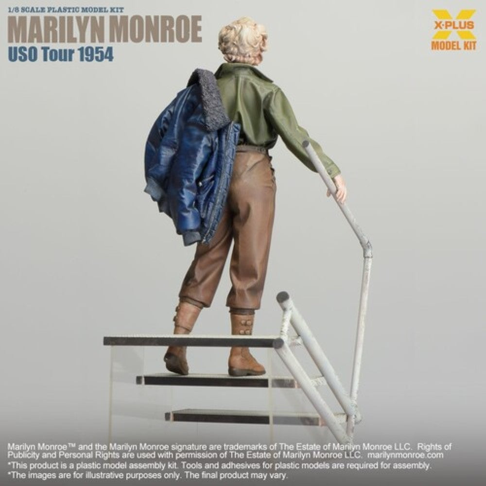 Marilyn Monroe USO Tour 1954 1/8 Scale Model Kit X-Plus figure viewed from behind holding jacket on stair rail.