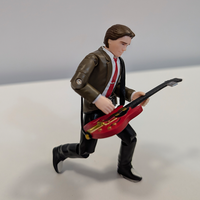 Super7 Back To The Future Marty McFly ReAction figure playing red electric guitar in dynamic pose on white background