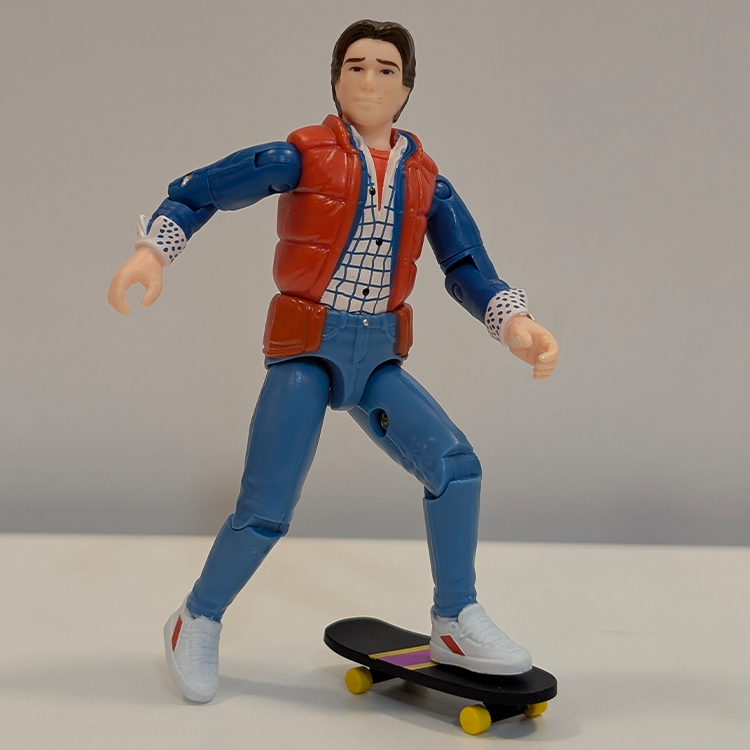 Super7 Back To The Future Marty McFly 1955 ReAction+ figure posed on skateboard with detailed clothing and sneakers