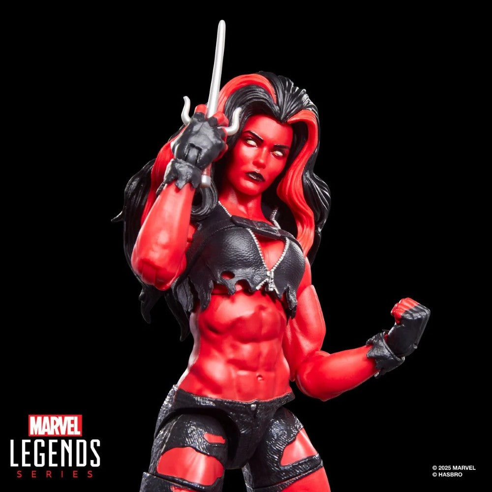 Hasbro Marvel Legends 6-inch Red She-Hulk figure with muscular red skin, black torn outfit, and sword accessory on black background