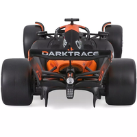 Bburago die-cast 1:43 scale McLaren MCL38 Formula 1 car in papaya orange with Oscar Piastri's helmet detail.