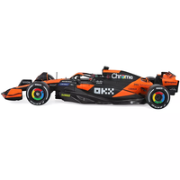 Bburago 1:43 scale die-cast model of McLaren MCL38 Formula 1 car with Oscar Piastri's helmet and livery details