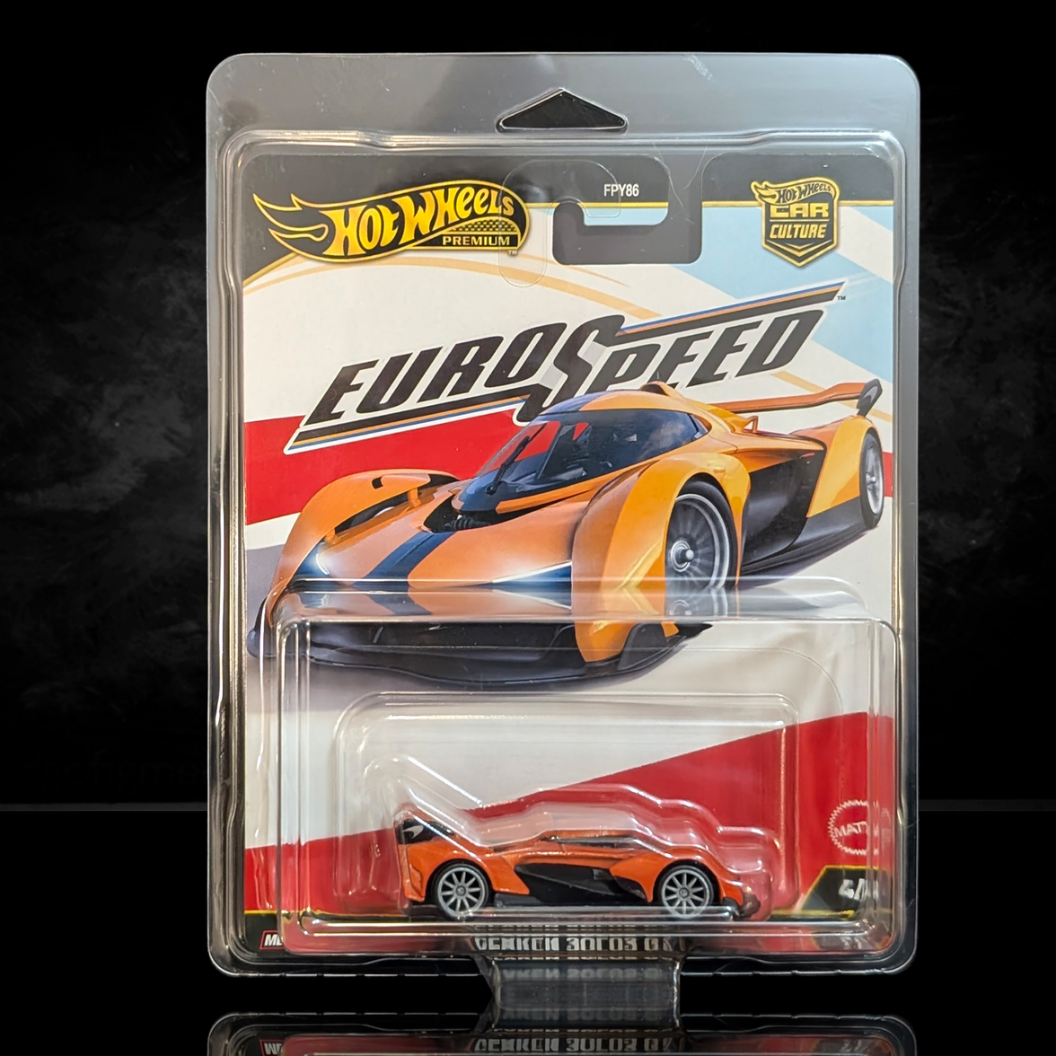 Hot Wheels Premium Euro Speed die-cast car in orange with black stripe and Real Riders wheels in collector blister packaging