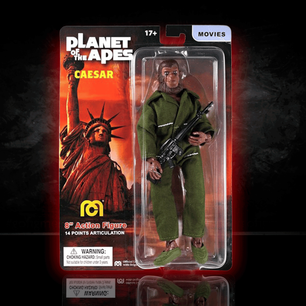 Mego 8-inch Planet of the Apes Caesar figure in green outfit holding rifle, displayed in themed collectible packaging