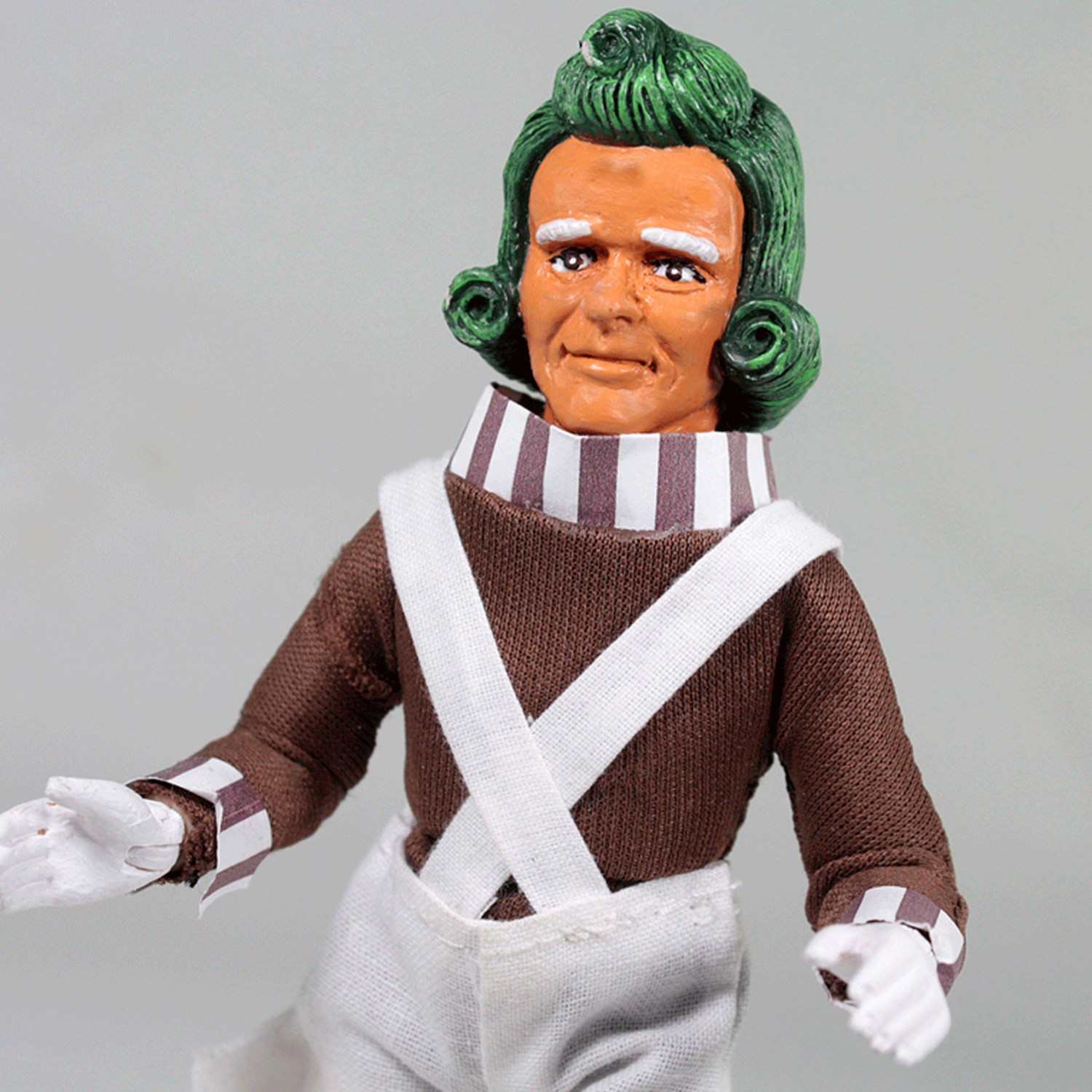 Mego 8-inch retro stylized figure with green hair, brown shirt, striped collar, and white overalls in collectible style