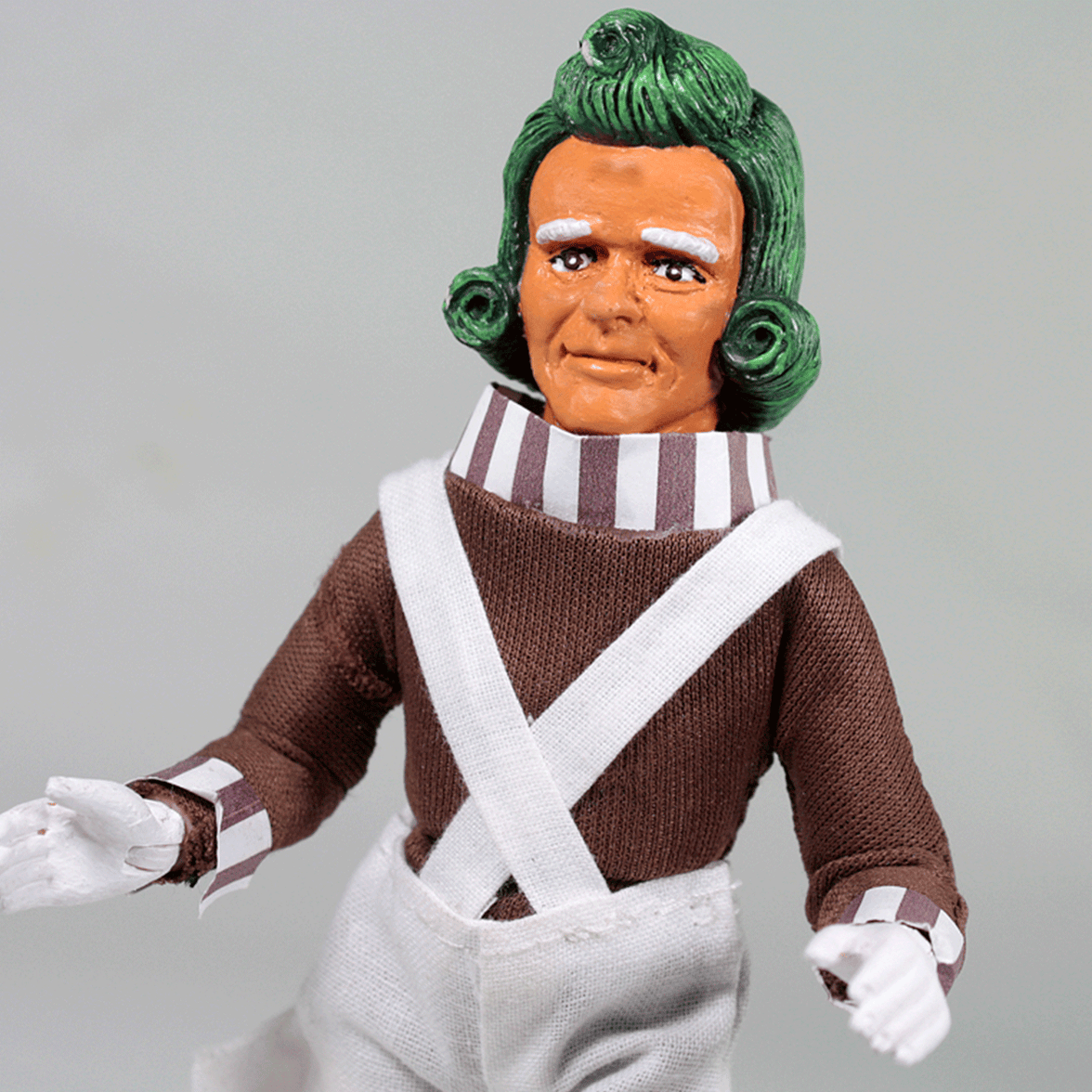 Mego 8-inch retro stylized figure with green hair, brown shirt, striped collar, and white overalls in collectible style