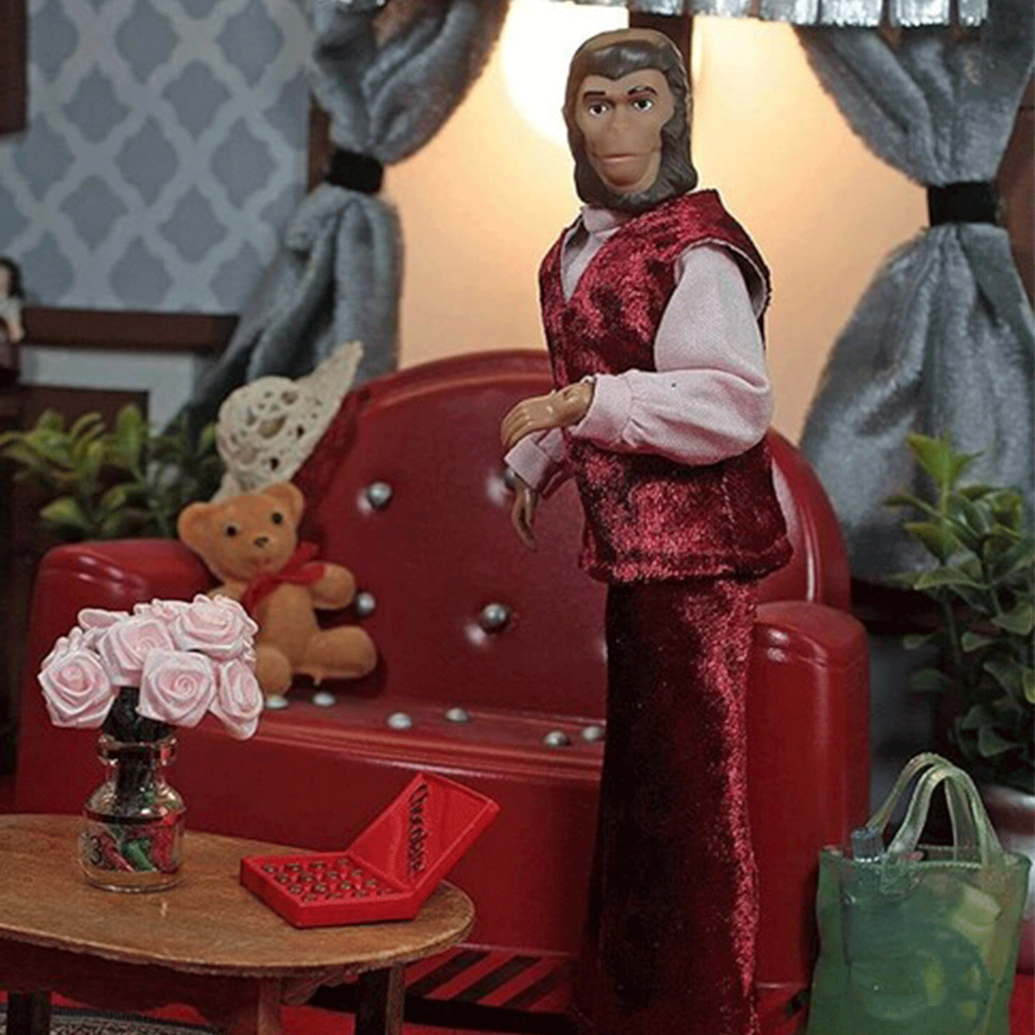 Mego 8-inch retro ape figure dressed in red velvet vest and pants posed in detailed vintage living room setting