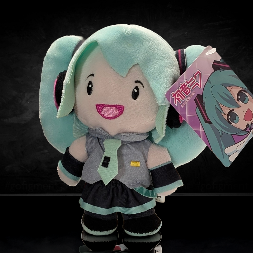 UCC 6-inch Hatsune Miku plush with teal twin tails and embroidered facial features holding a character tag