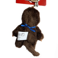4" Monchhichi Keychain - Classic Boy, Blue Bib Mascot - Authentic Plush Mascot, NWT by Sekiguchi showing back view with tag and blue ribbon
