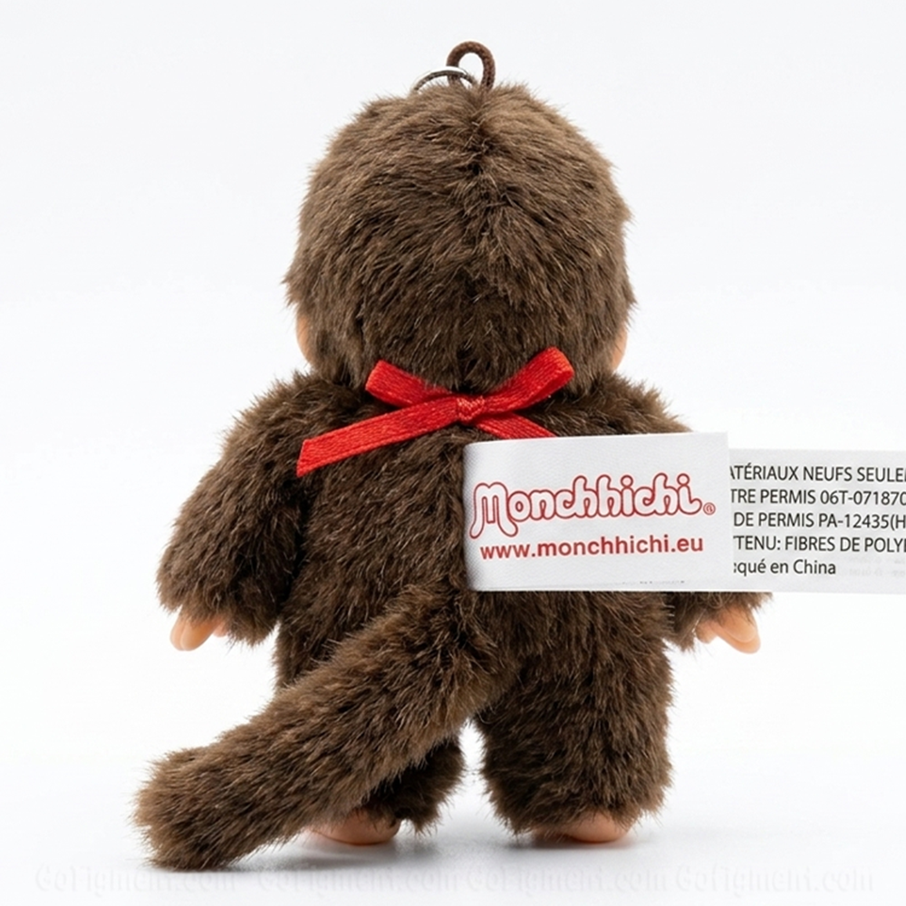 4" Monchhichi Keychain - Classic Boy, Red Bib Mascot - Authentic Plush Mascot, NWT by Sekiguchi shown from back view with tag visible