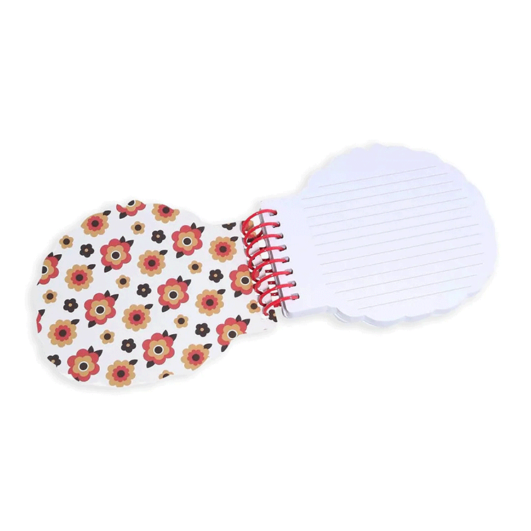 Go Figment Monchhichi die-cut spiral journal open to floral pattern and lined pages with red binding on white background