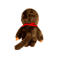 Sekiguchi Monchhichi plush toy viewed from back wearing a bright red bib with soft brown fur and tail