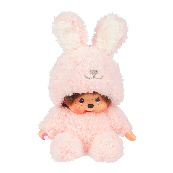 Sekiguchi Monchhichi plush doll dressed in a soft pink fluffy bunny costume sitting with thumb in mouth.