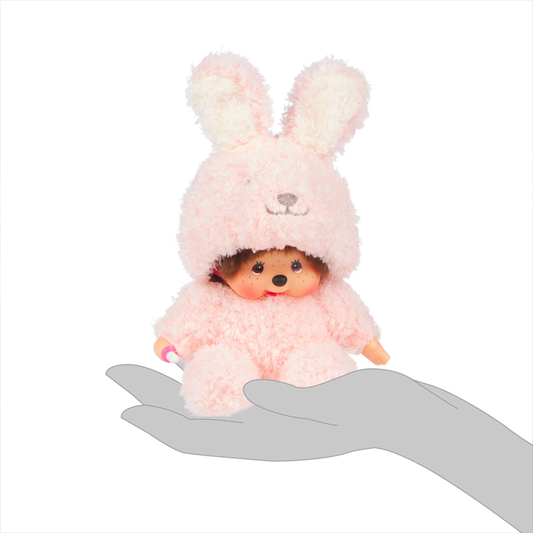 Sekiguchi Monchhichi 7-inch sitting plush in soft pink fuzzy bunny costume with thumb in mouth pose.