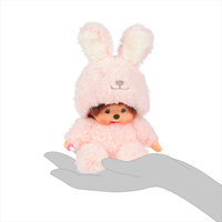 Sekiguchi Monchhichi 7-inch sitting plush in soft pink fuzzy bunny costume with thumb in mouth pose.