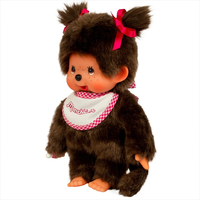 Sekiguchi Monchhichi classic 7-inch plush monkey with white and pink bib and pink hair ribbons standing upright