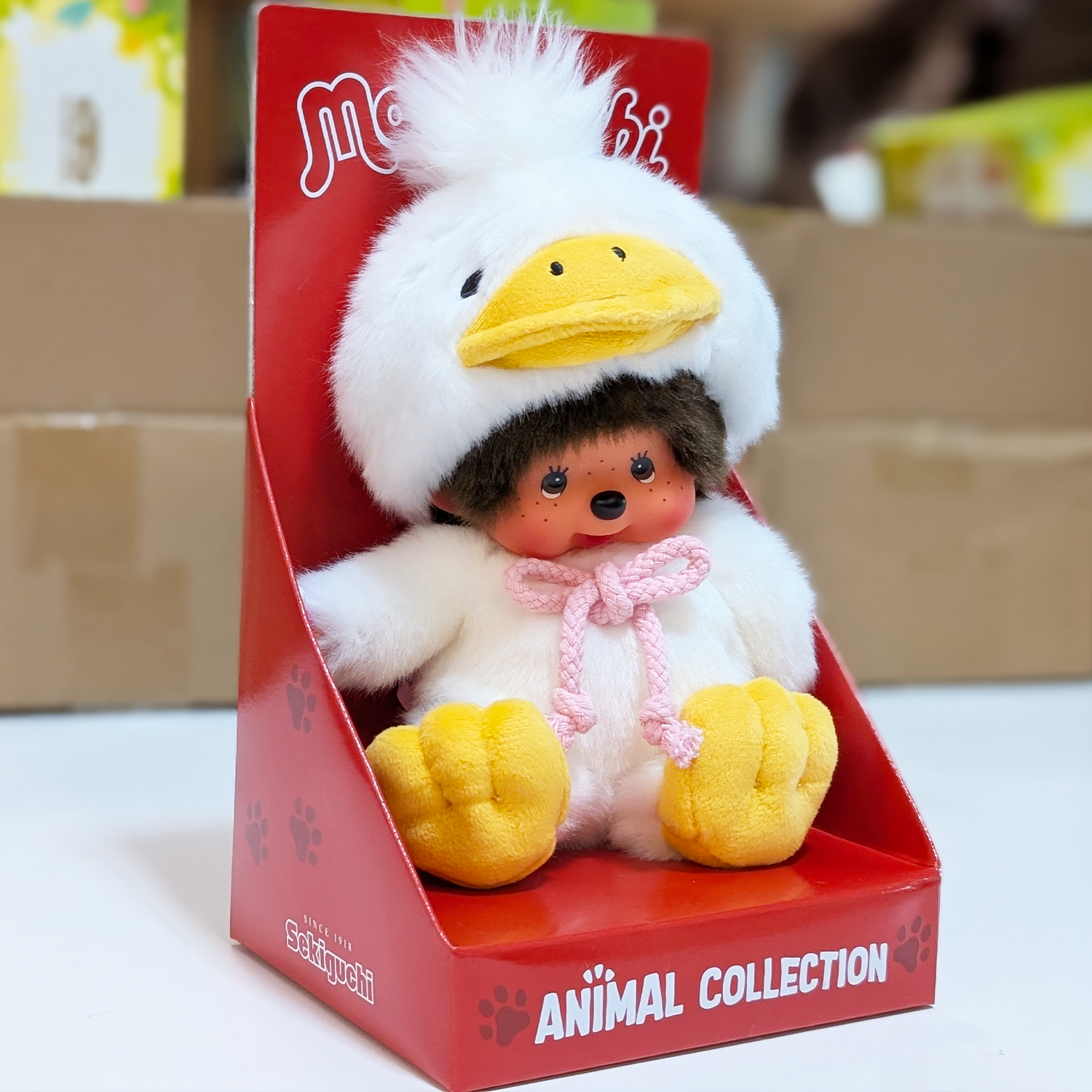 Official Sekiguchi Monchhichi 8-inch Animal Friends Duck plush doll wearing a yellow duckling hood, often searched as Monchichi.