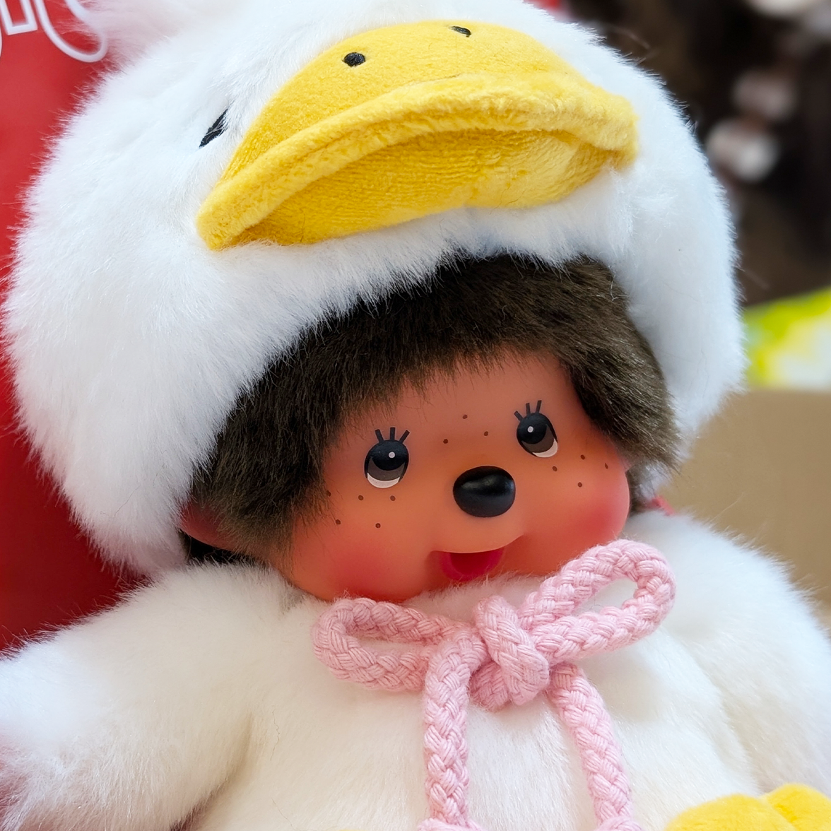 Official Sekiguchi Monchhichi 8-inch Animal Friends Duck plush doll wearing a yellow duckling hood, often searched as Monchichi.
