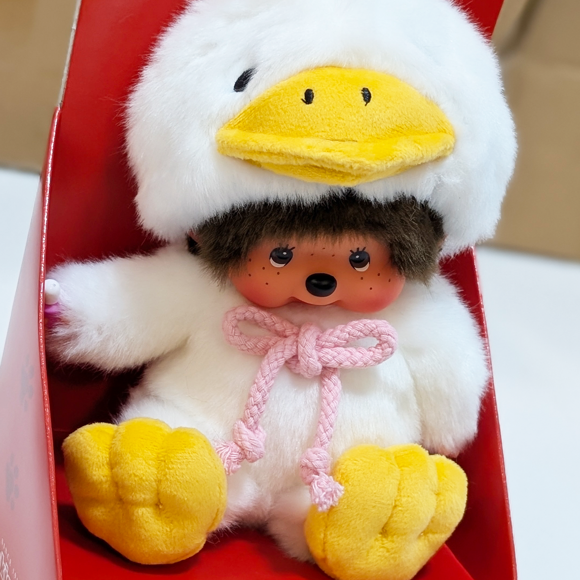 Official Sekiguchi Monchhichi 8-inch Animal Friends Duck plush doll wearing a yellow duckling hood, often searched as Monchichi.