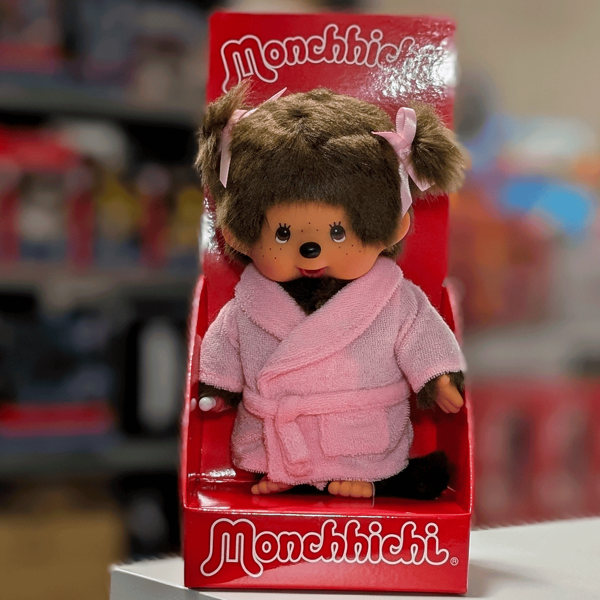 Sekiguchi Monchhichi 8 inch girl plush doll wearing pink bathrobe with pigtails in original red box