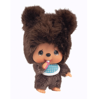 Sekiguchi 4-inch Monchhichi keychain in fluffy brown bear costume with blue bib holding pink bottle and thumb near mouth
