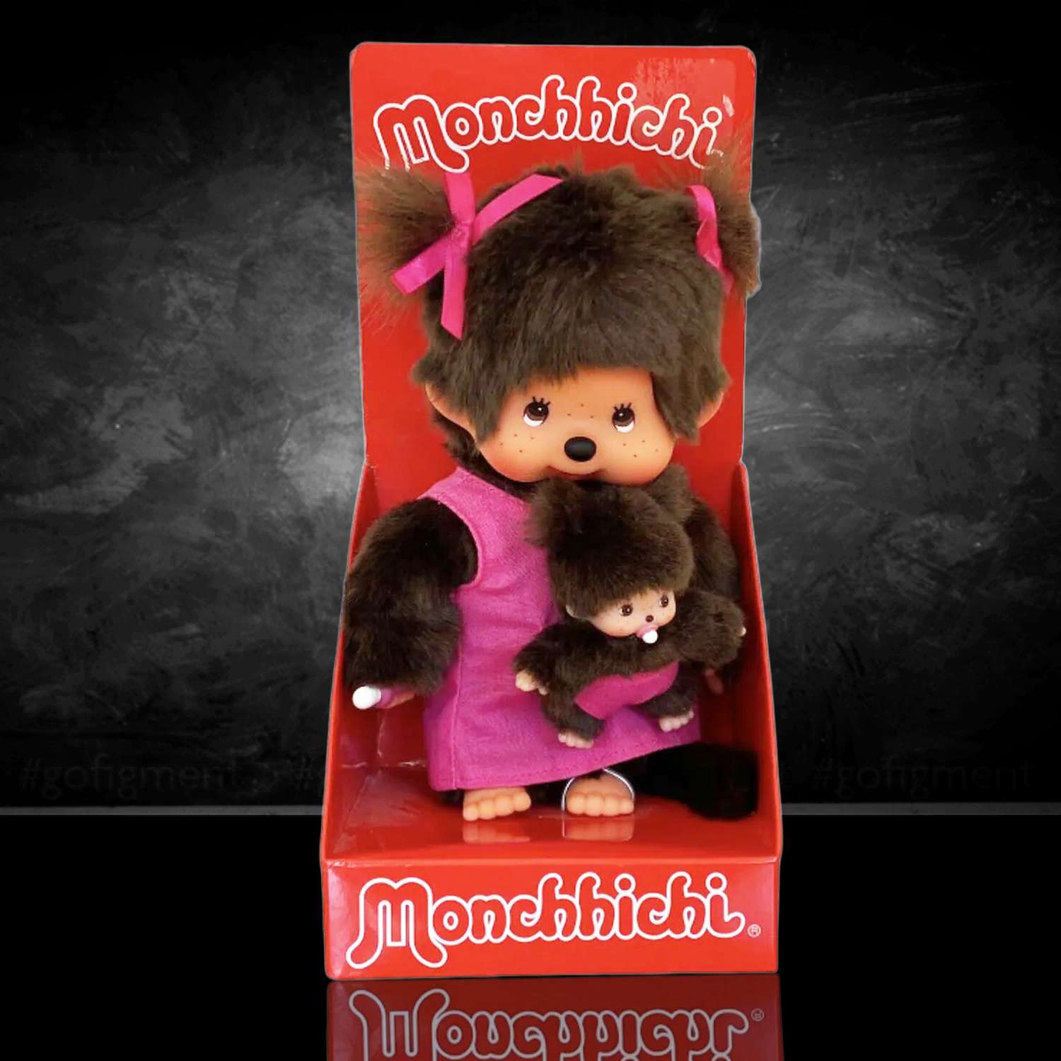 Official Sekiguchi Monchhichi 8-inch Mothercare pink plush doll holding a matching baby monkey, often spelled Monchichi.