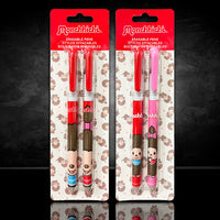 Two Monchhichi erasable pen sets by Sekiguchi featuring vintage character designs and red or pink caps on display cards.