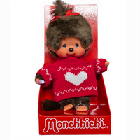 Monchhichi doll with brown hair and a red heart sweater in red display packaging