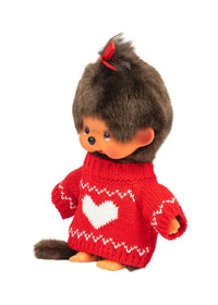 Brown-haired Monchhichi doll wearing a red knit sweater with a white heart pattern