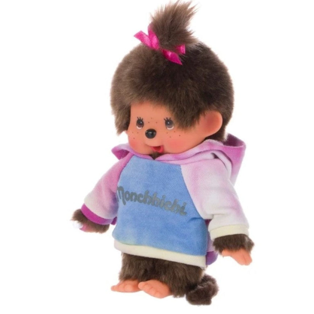 A plush toy monkey doll with brown fur, wearing a pink, purple, and blue hoodie with 'Monchielita' written on the front, set against a plain white background.