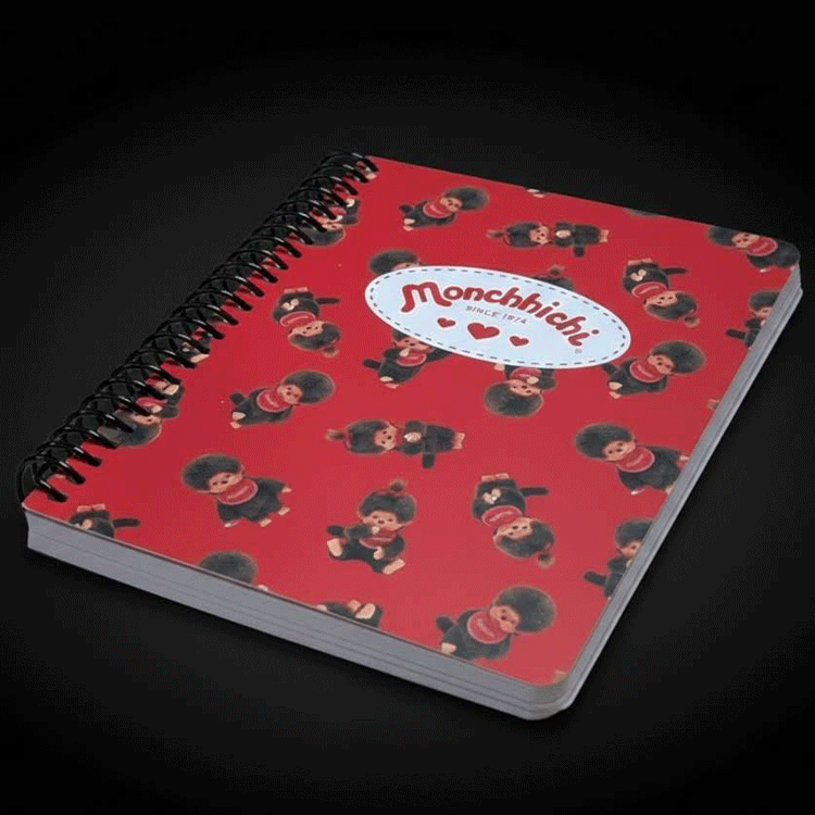 Go Figment Monchhichi Since 1974 red spiral-bound journal with kawaii character pattern and logo on front cover