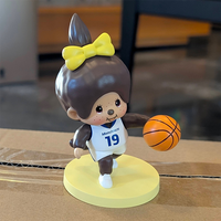 Sekiguchi Girl Monchhichi basketball player vinyl figure with yellow bow and basketball on yellow stand