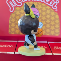 Sekiguchi Girl Monchhichi basketball player vinyl figure with yellow ribbon, dribbling on a yellow base.