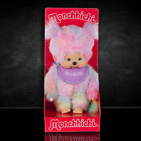 Sekiguchi Monchhichi tie-dye girl plush doll in colorful soft fur with a purple bib in retail packaging