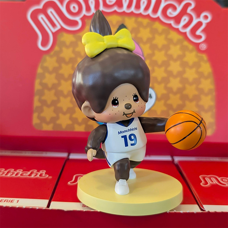 Sekiguchi Monchhichi basketball figure in white uniform dribbling ball on yellow base with red background