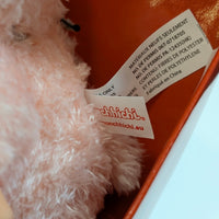 Sekiguchi Monchhichi fluffy pink bunny doll plush with fabric and care tags inside an orange box