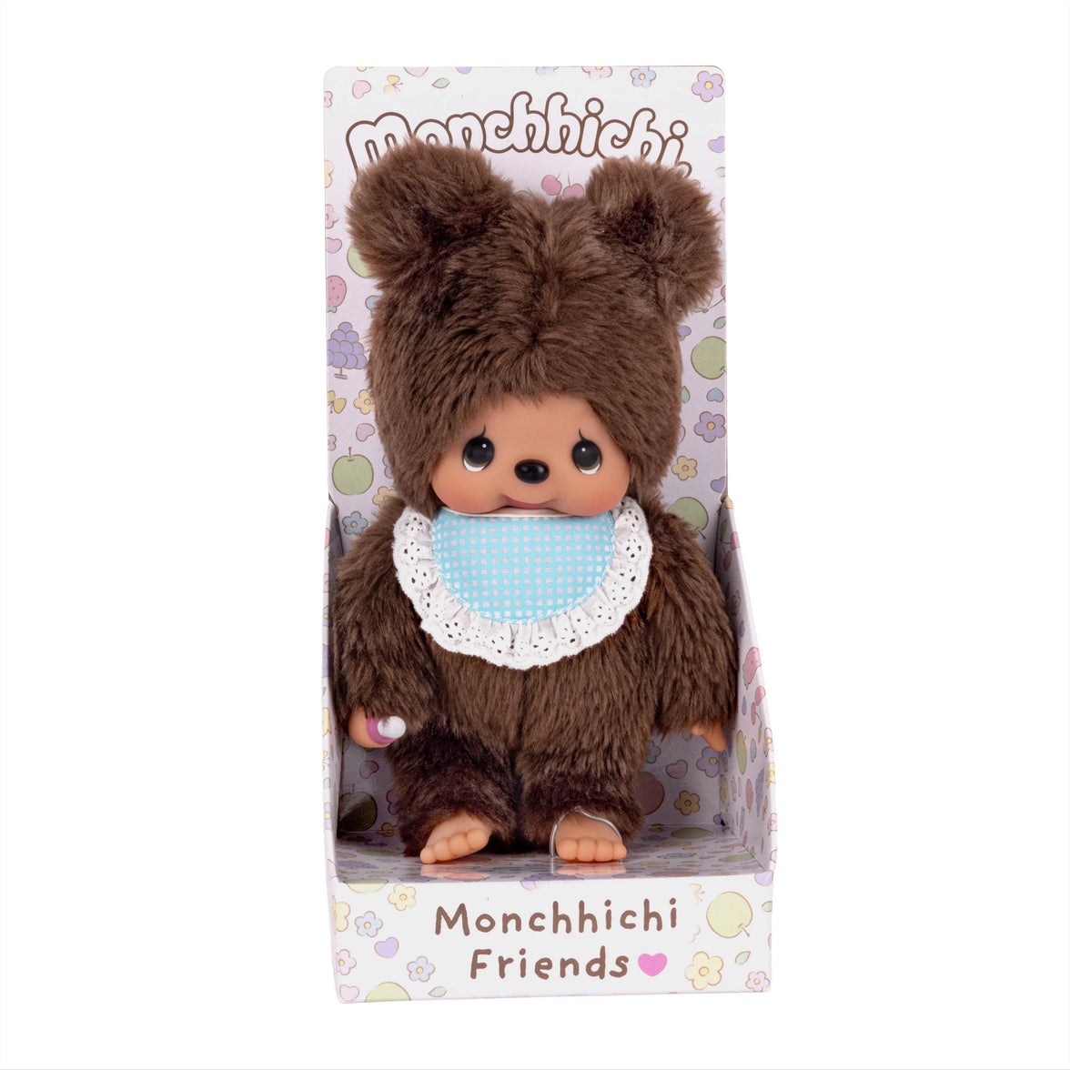 Brown Monchhichi doll with a blue bib in Monchhichi Friends packaging