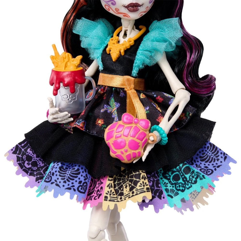 Skelita Calaveras - Moonspell Magic by Monster High 10.5 Inces IN-HAND doll by Mattel holding themed accessories.