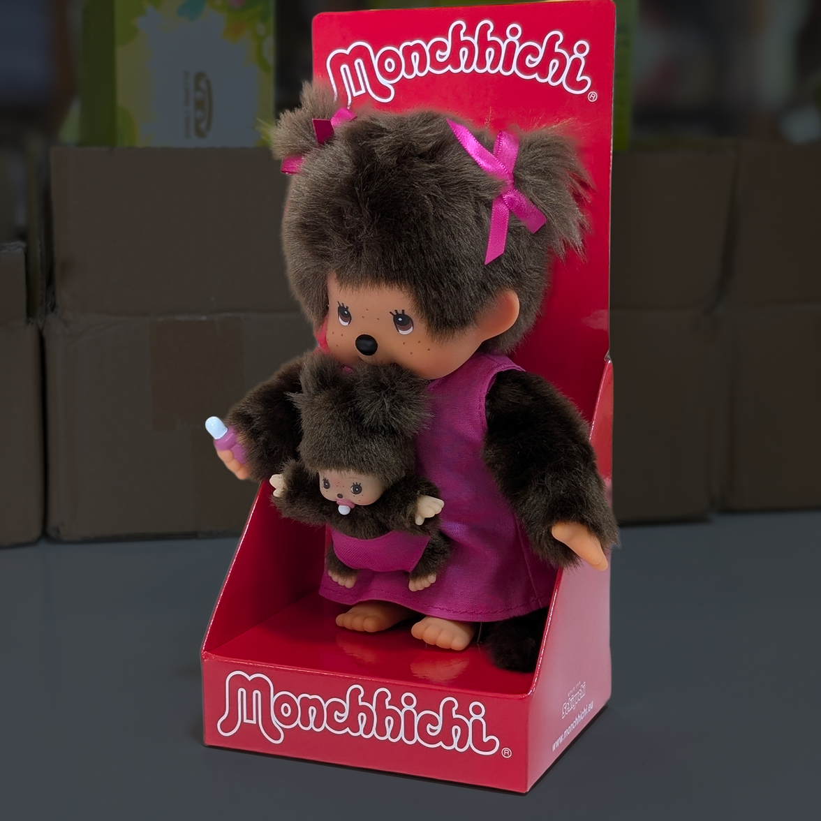 Official Sekiguchi Monchhichi 8-inch Mothercare pink plush doll holding a matching baby monkey, often spelled Monchichi.