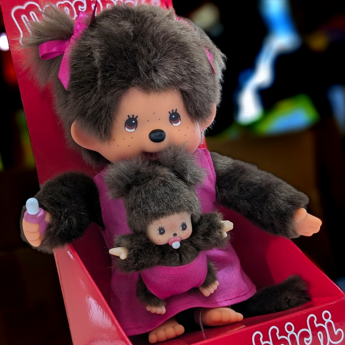 Official Sekiguchi Monchhichi 8-inch Mothercare pink plush doll holding a matching baby monkey, often spelled Monchichi.