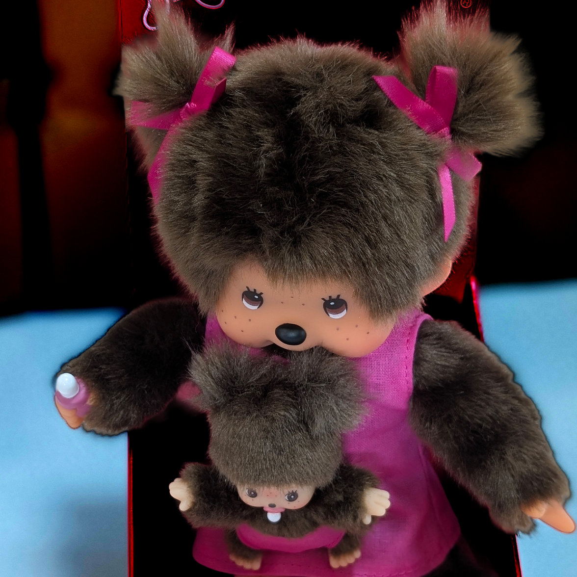 Official Sekiguchi Monchhichi 8-inch Mothercare pink plush doll holding a matching baby monkey, often spelled Monchichi.