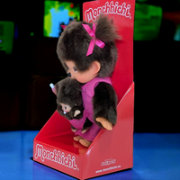 Official Sekiguchi Monchhichi 8-inch Mothercare pink plush doll holding a matching baby monkey, often spelled Monchichi.