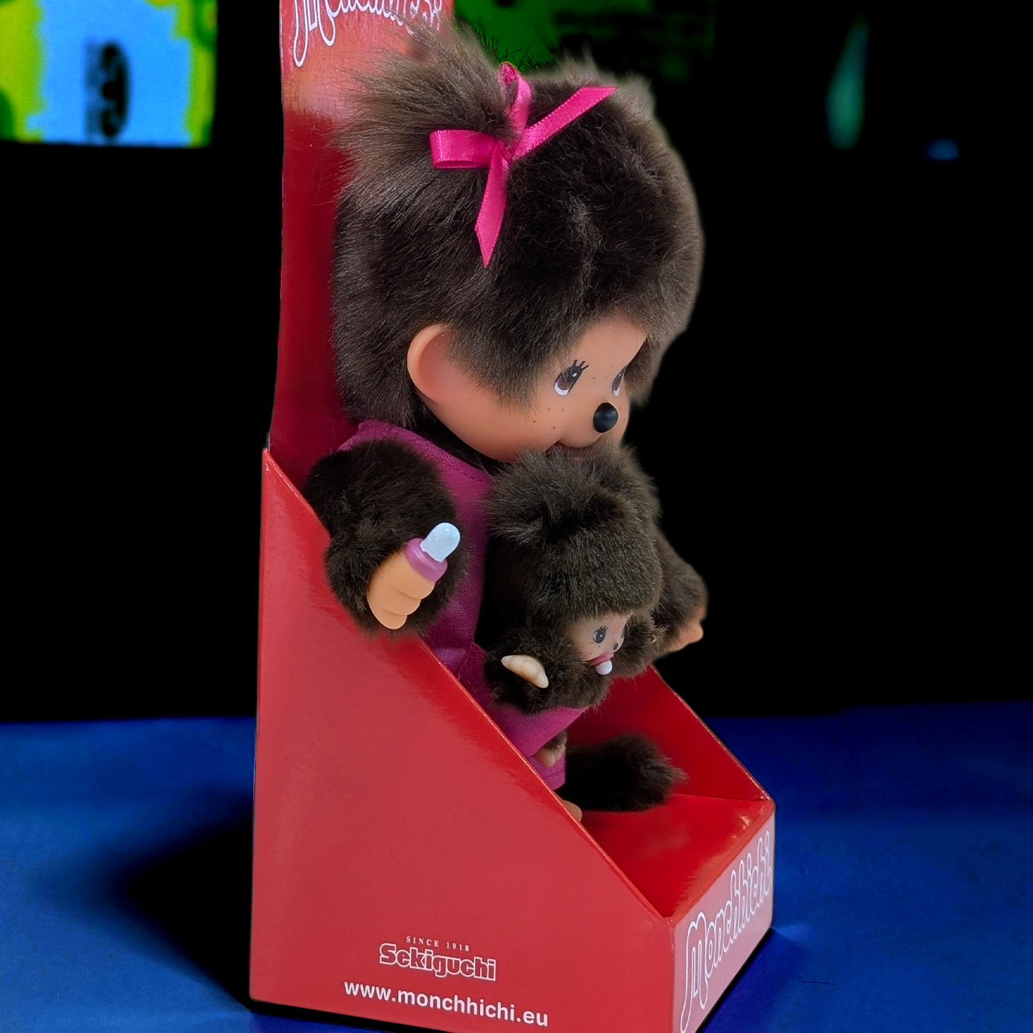 Official Sekiguchi Monchhichi 8-inch Mothercare pink plush doll holding a matching baby monkey, often spelled Monchichi.