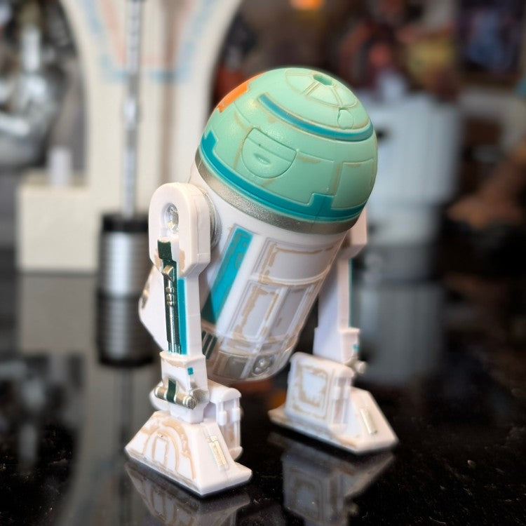 Kenner NO-AH Star Wars Droid Factory loose astromech figure with weathered paint and articulated dome on black surface