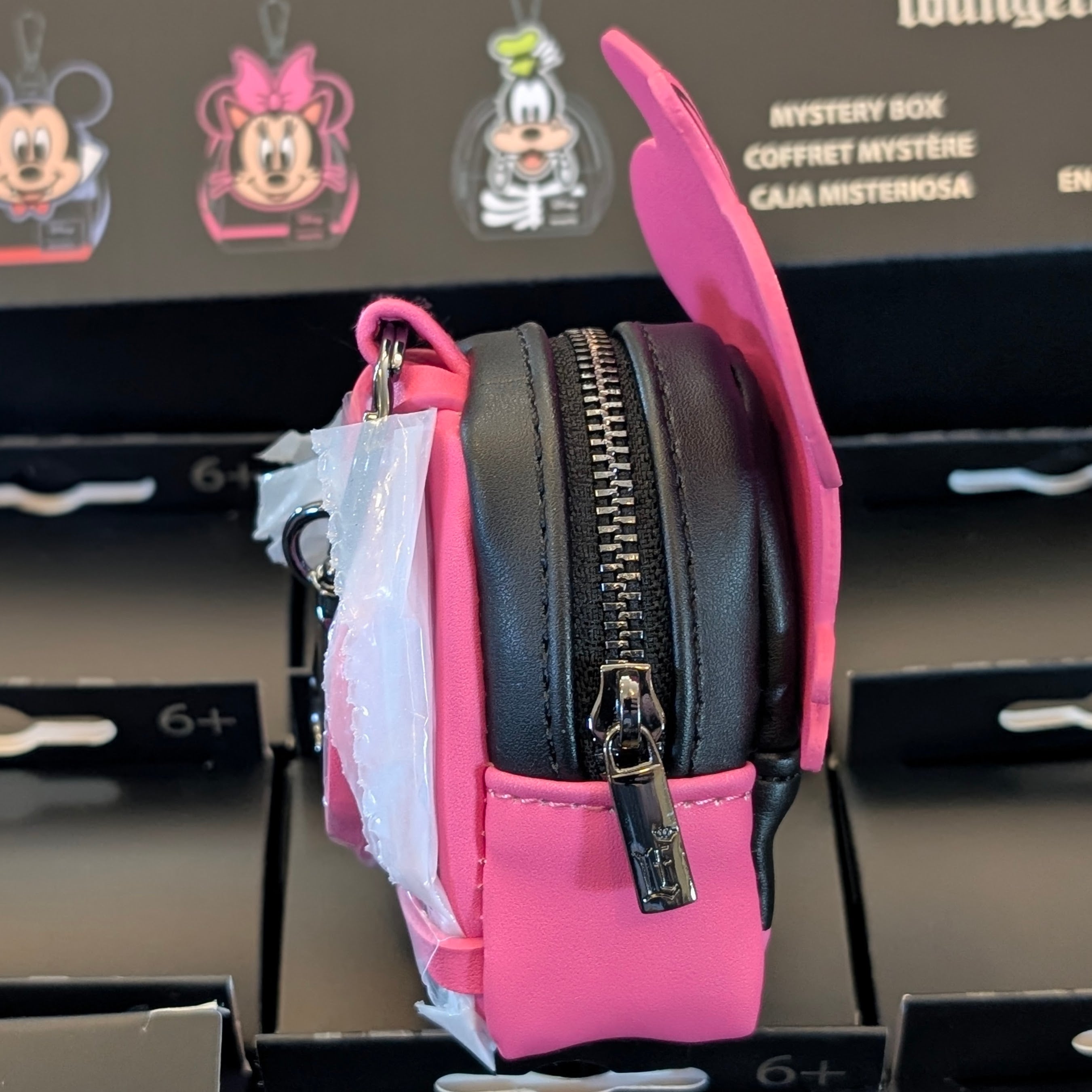 Loungefly Disney mini backpack bag charm featuring Minnie Mouse in a cat costume with a working zipper detail.
