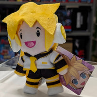 UCC 6-inch Kagamine Len plush with yellow hair, white headphones, black and yellow outfit smiling with tag on clear display stand